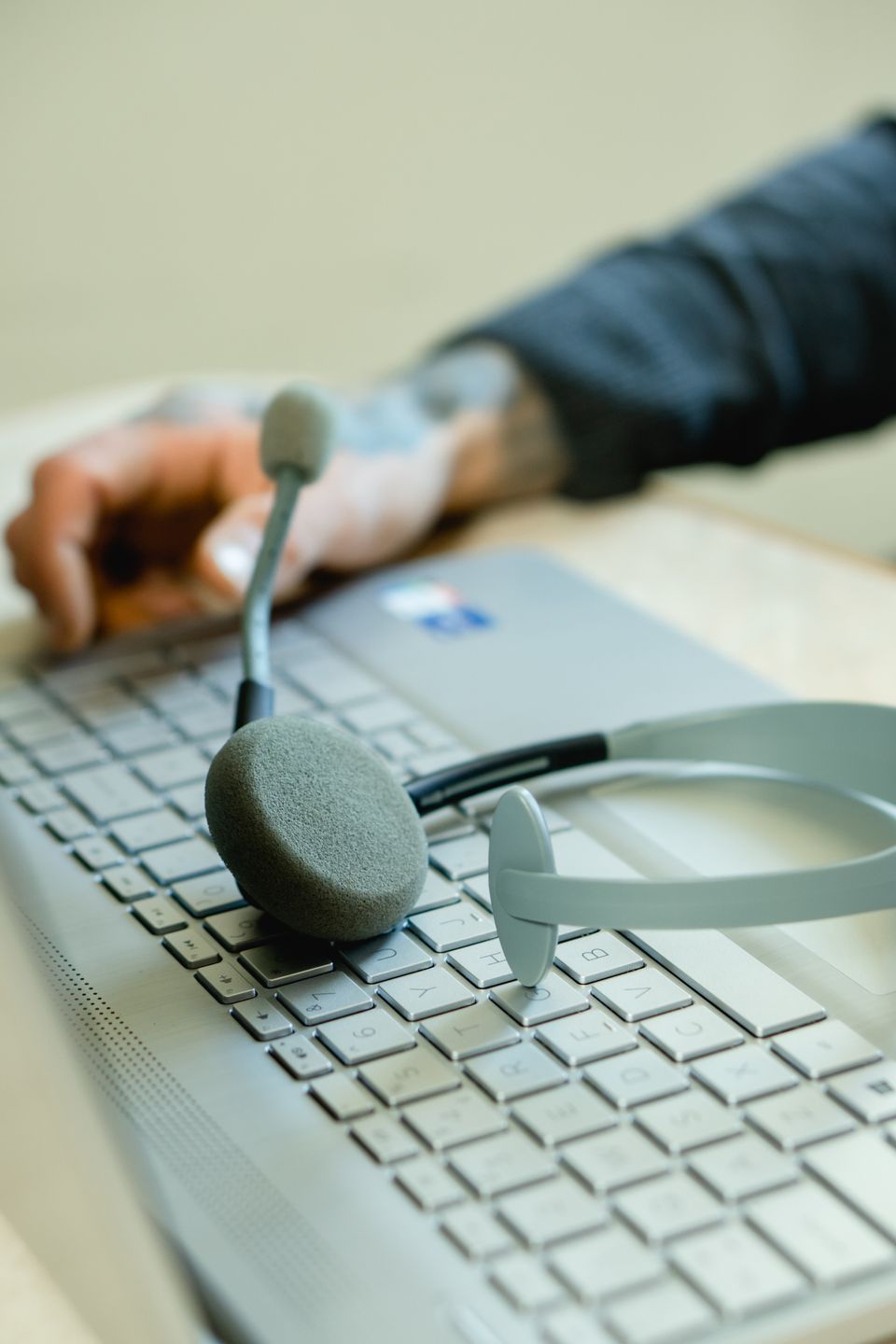 Customer support headset beside a laptop