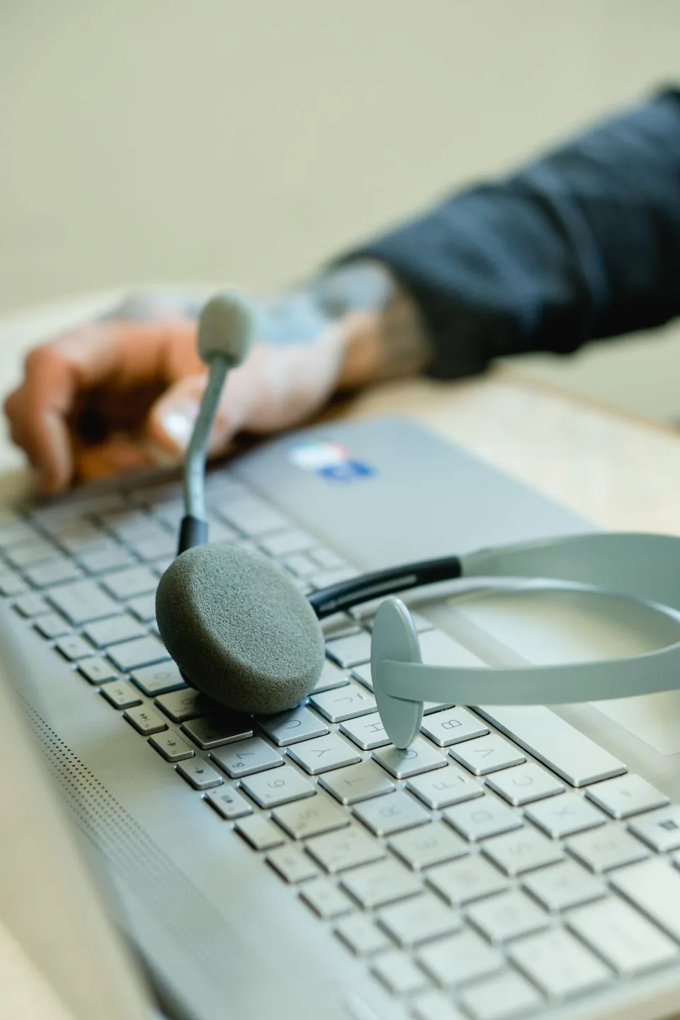 Customer support headset beside a laptop